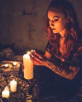 Mystical woman lighting candles