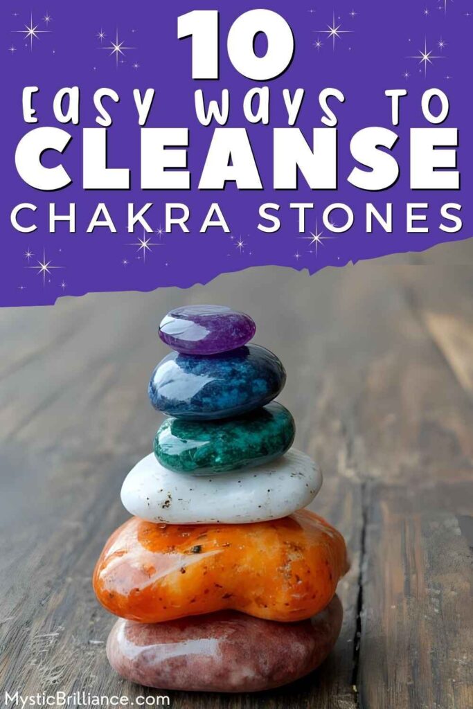 Picture of a stack of seven polished chakra stones displayed against a wooden background with text overlay 10 Easy Ways to Cleanse Chakra Stones