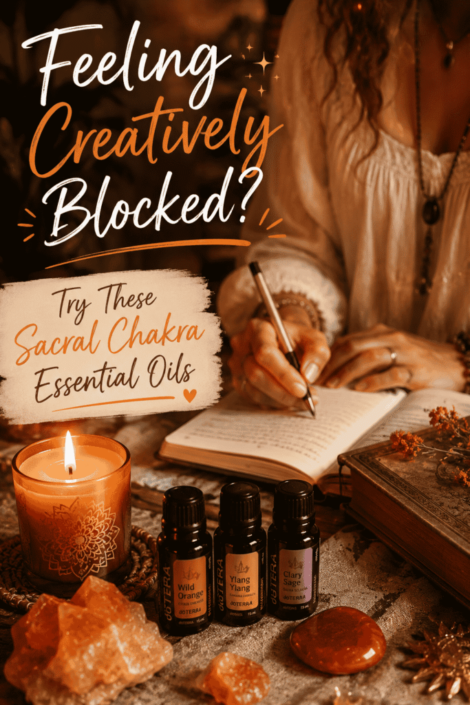 Picture of a person writing in a notebook beside a lit candle and several essential oil bottles labeled for the sacral chakra with text overlay Feeling Creatively Blocked? Try These Sacral Chakra Essential Oils
